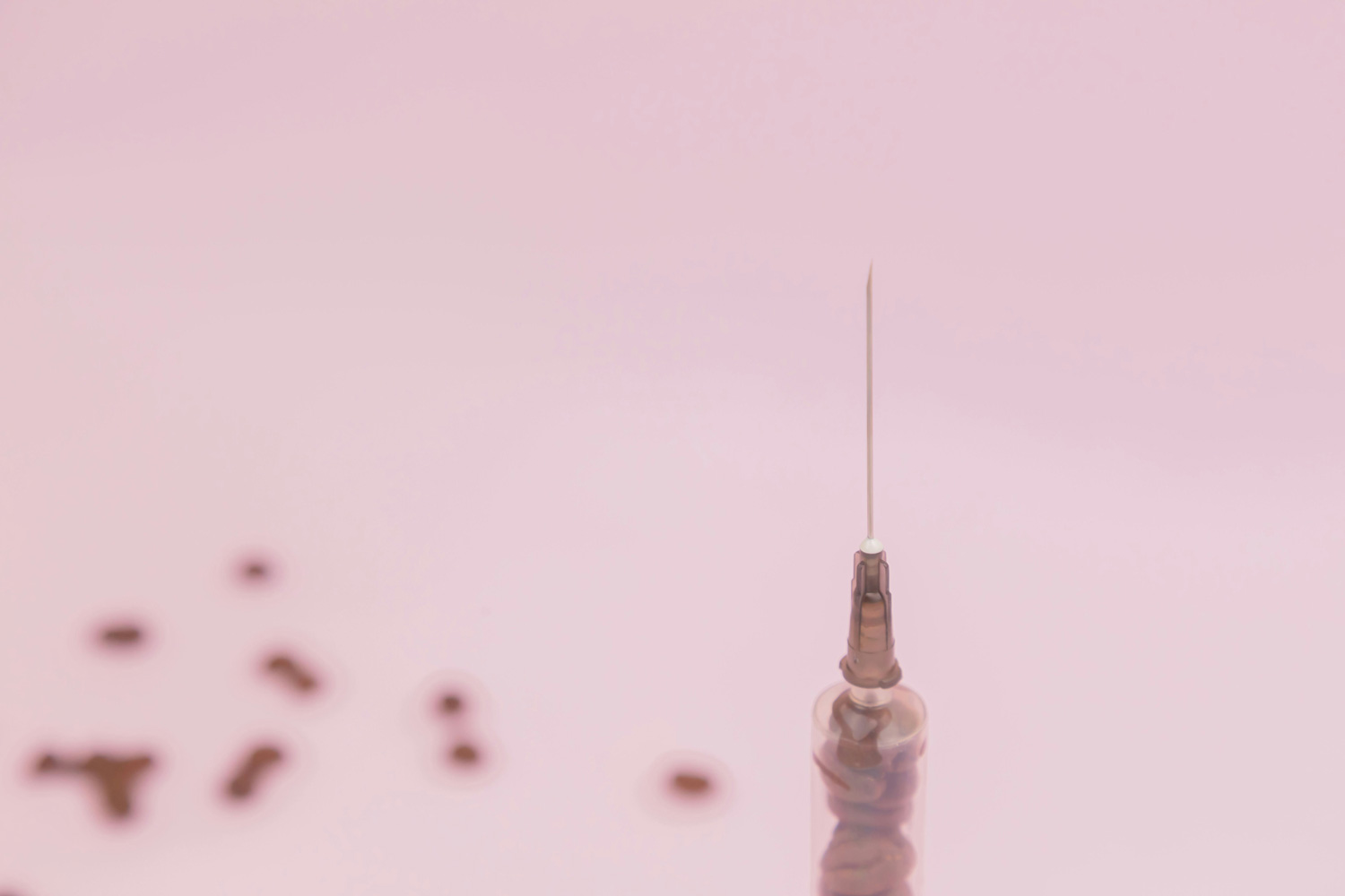 injection on a pink background